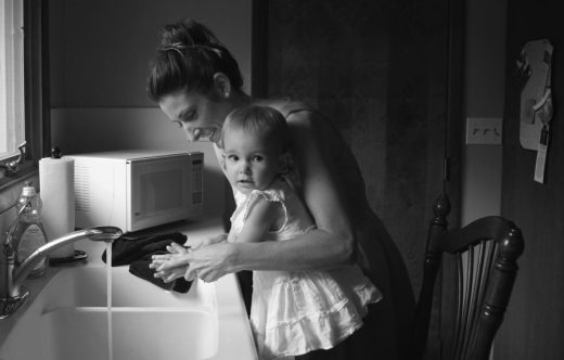 Mother washing child's hands image